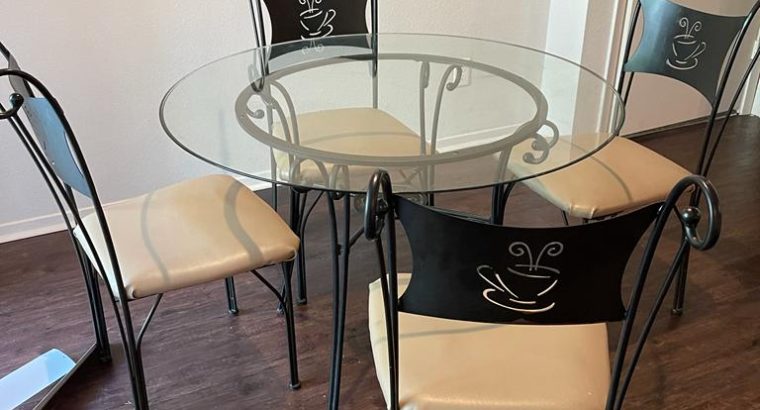 Glass dining table with 4 chairs – $50